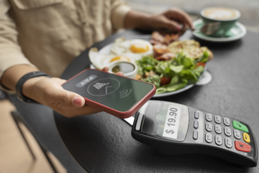 Restaurant manager tracking daily restaurant cash flow on a tablet